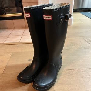 Black tall hunter boots